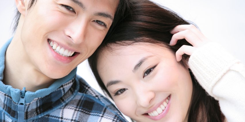 Asian couple who are happy with the dentists and dental service at Family Dental Care in Temple Hills, MD